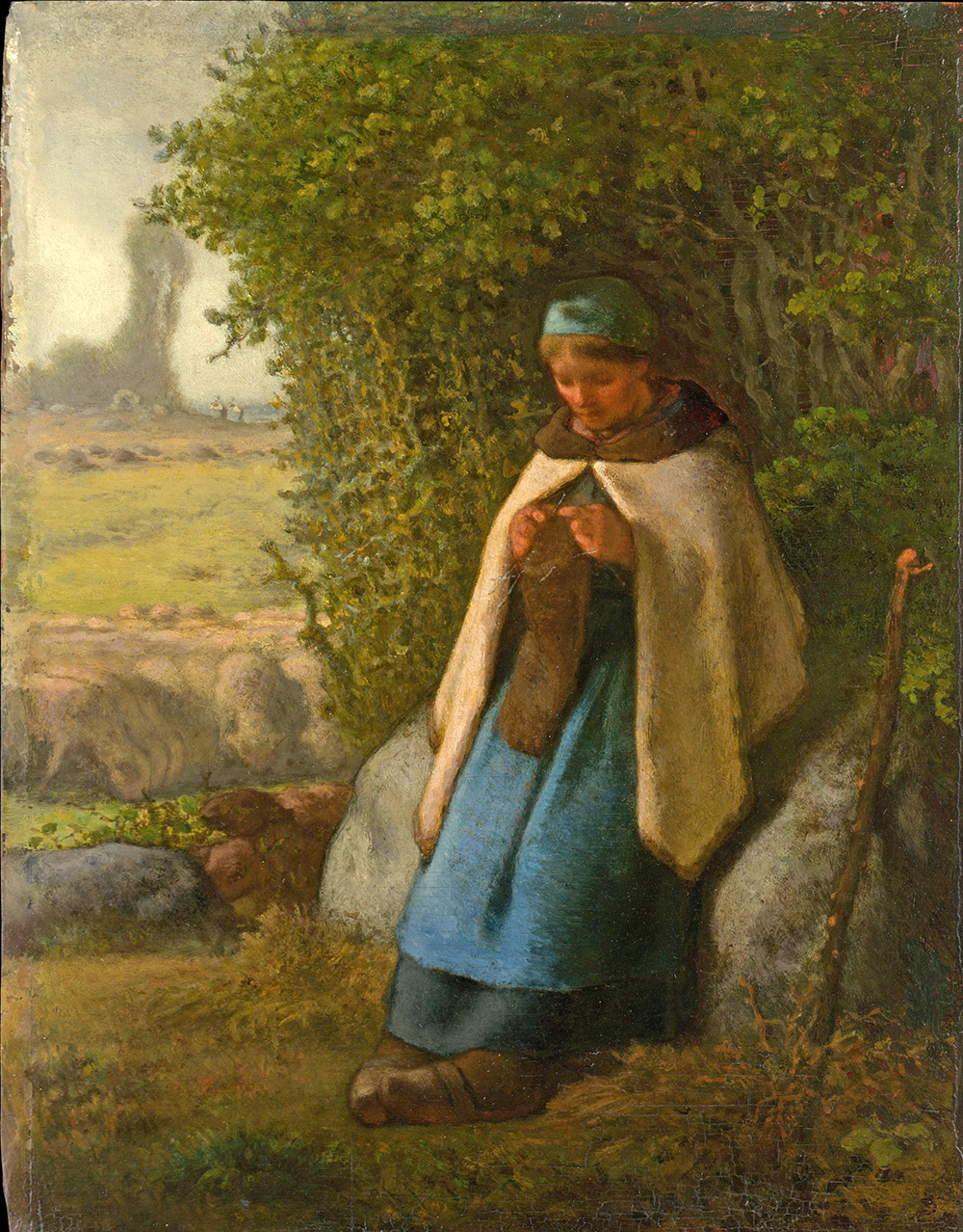 shepherdess seated on a rock